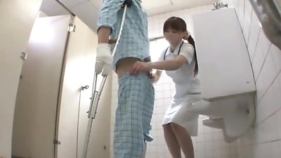 Nasty Japanese nurse gives a handjob to the patient